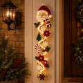 Jolly Santa face Christmas door hanger banner with red and gold bows