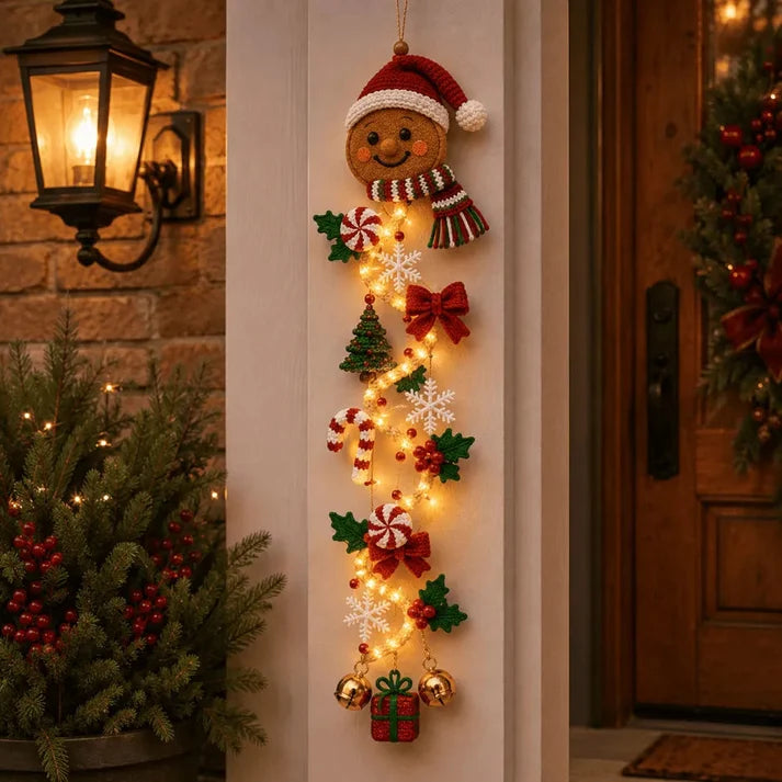 Cheerful gingerbread man Christmas door hanger with cookies, bows and stars